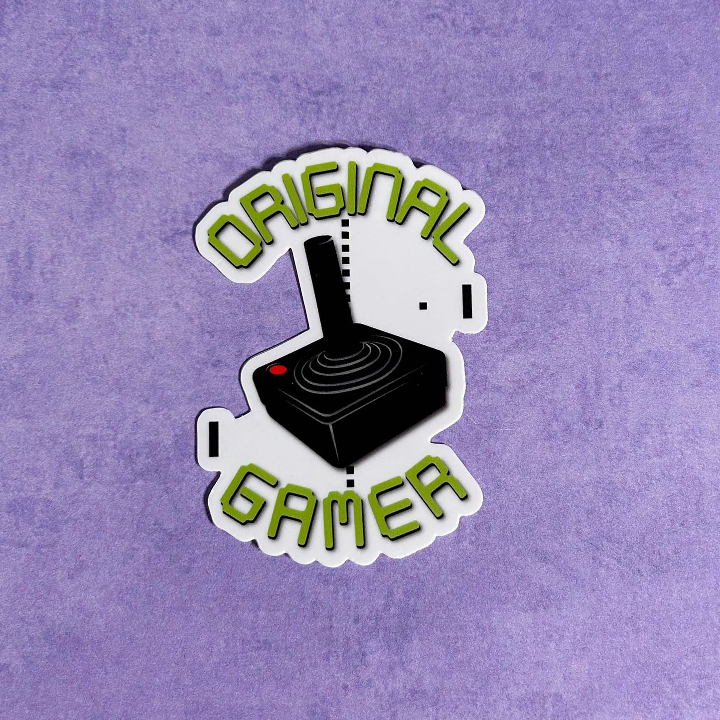 Original Gamer 3" Die-Cut Vinyl Sticker on a purple background