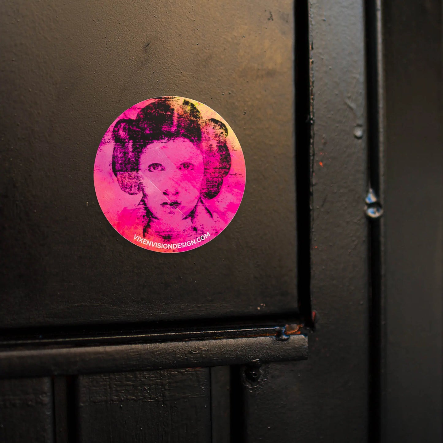 Rebel Resonance 3" Circle Sticker on a black door