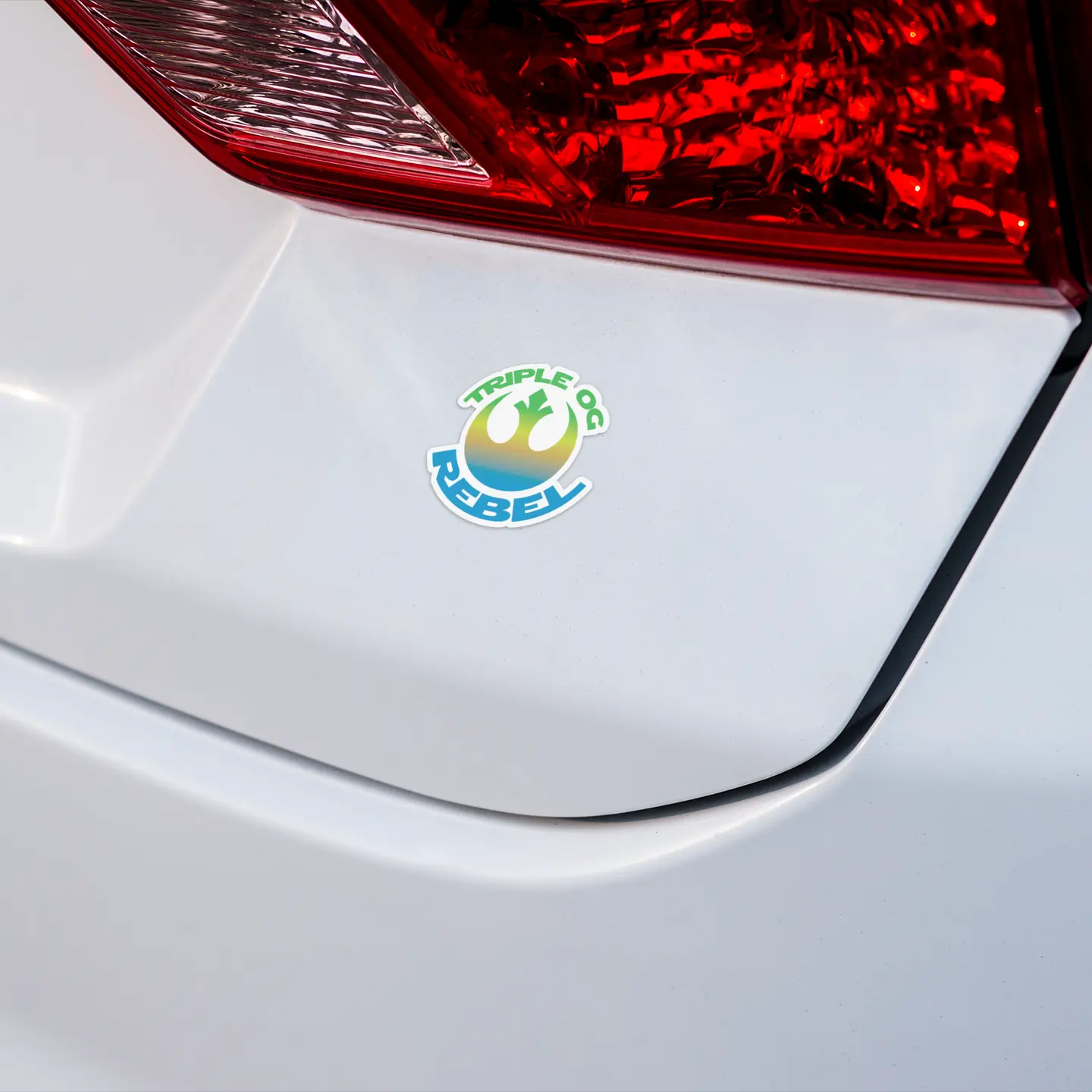 Triple OG Rebel 3" Vinyl Sticker on a white car