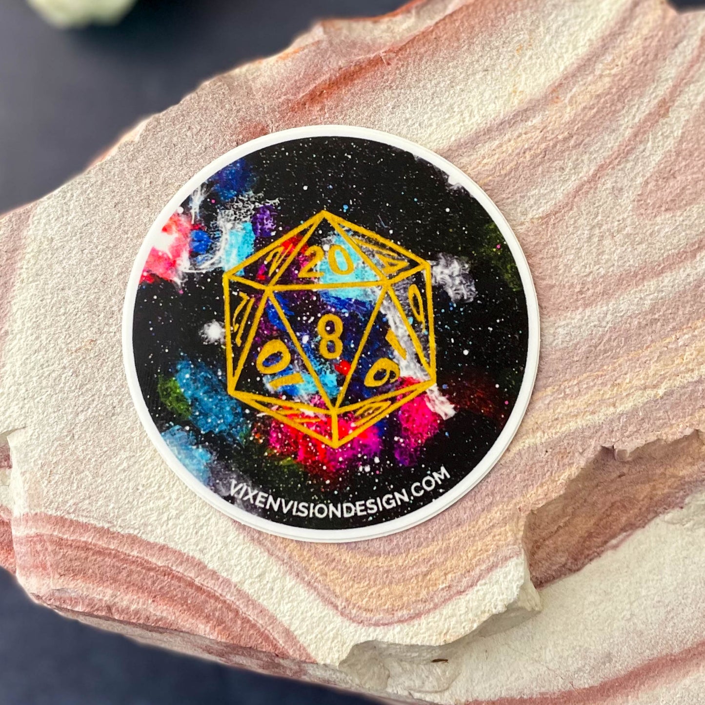 D20 Orion Nebula 3" Circle Sticker on rock