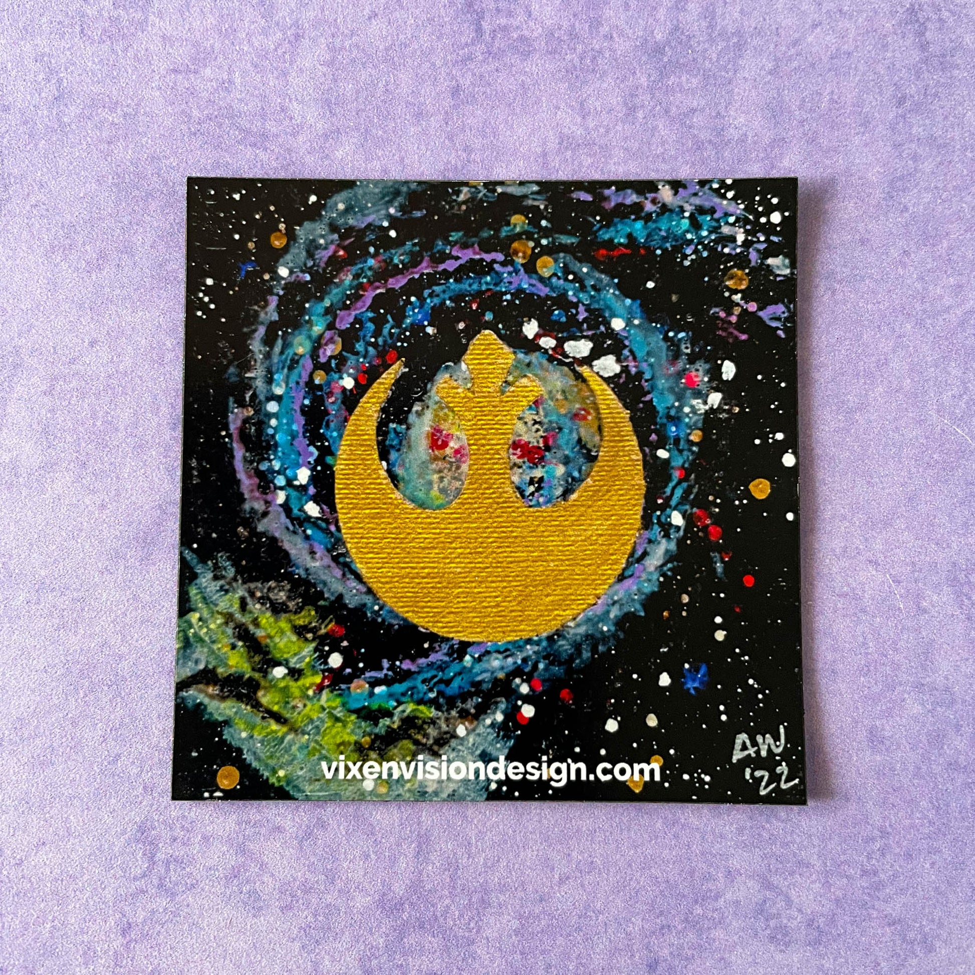 Gold Rebel M51 Magnet on purple background