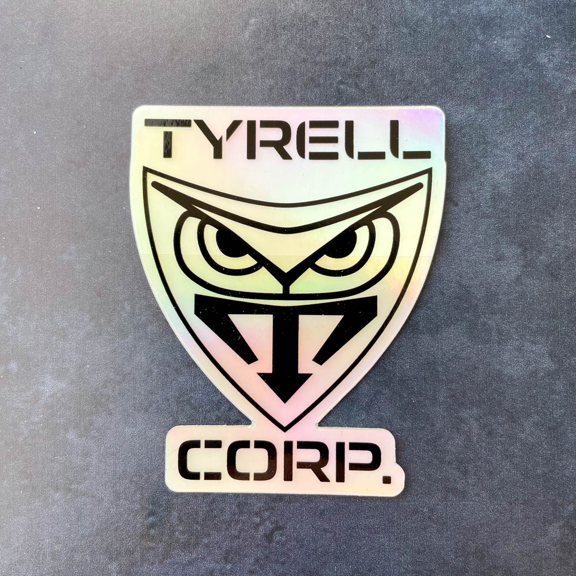 Tyrell Corp Holographic 3" Sticker on dark blue background