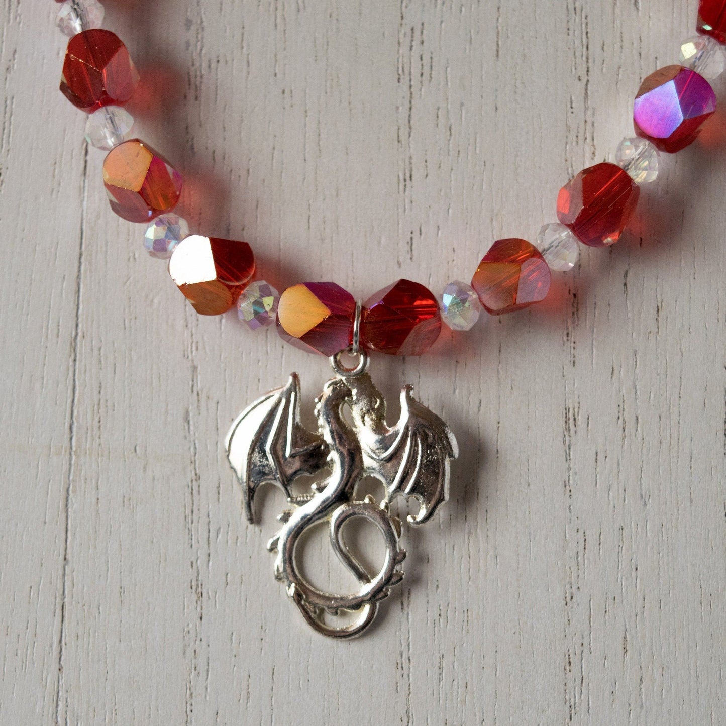 Fiery Dragon Beaded Necklace on white wood