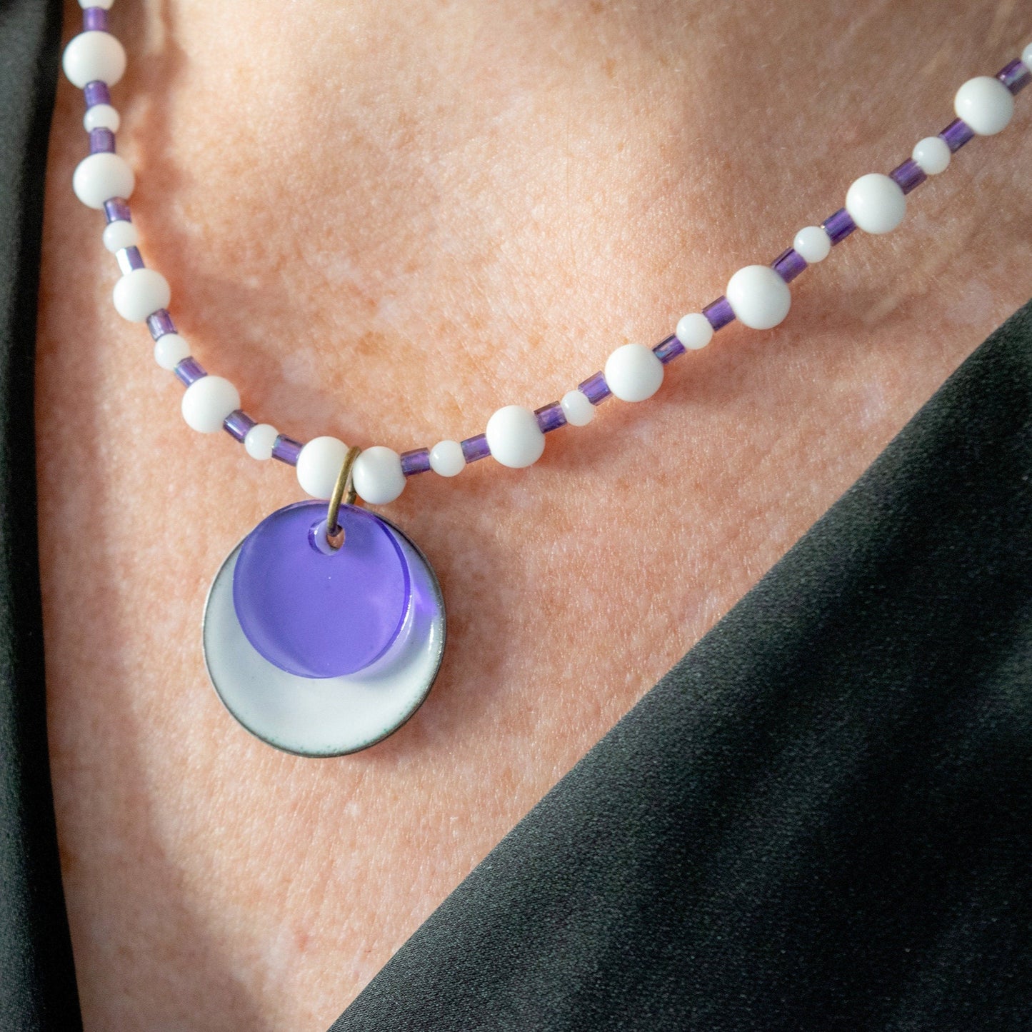 Purple and White Layered Enamel and Glass Pendant Bead Necklace on model tilted to the left