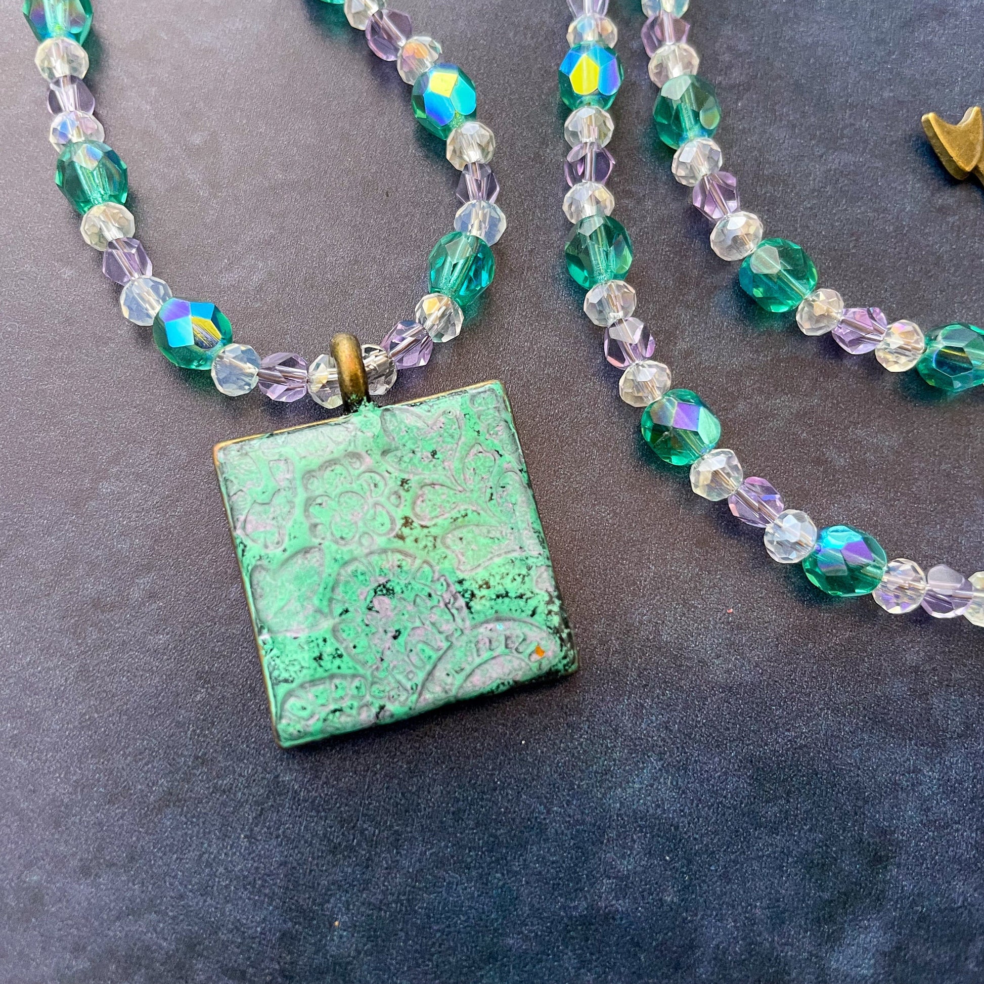 Aqua and Lavender Paisley Clay Pendant Bead Necklace on slate