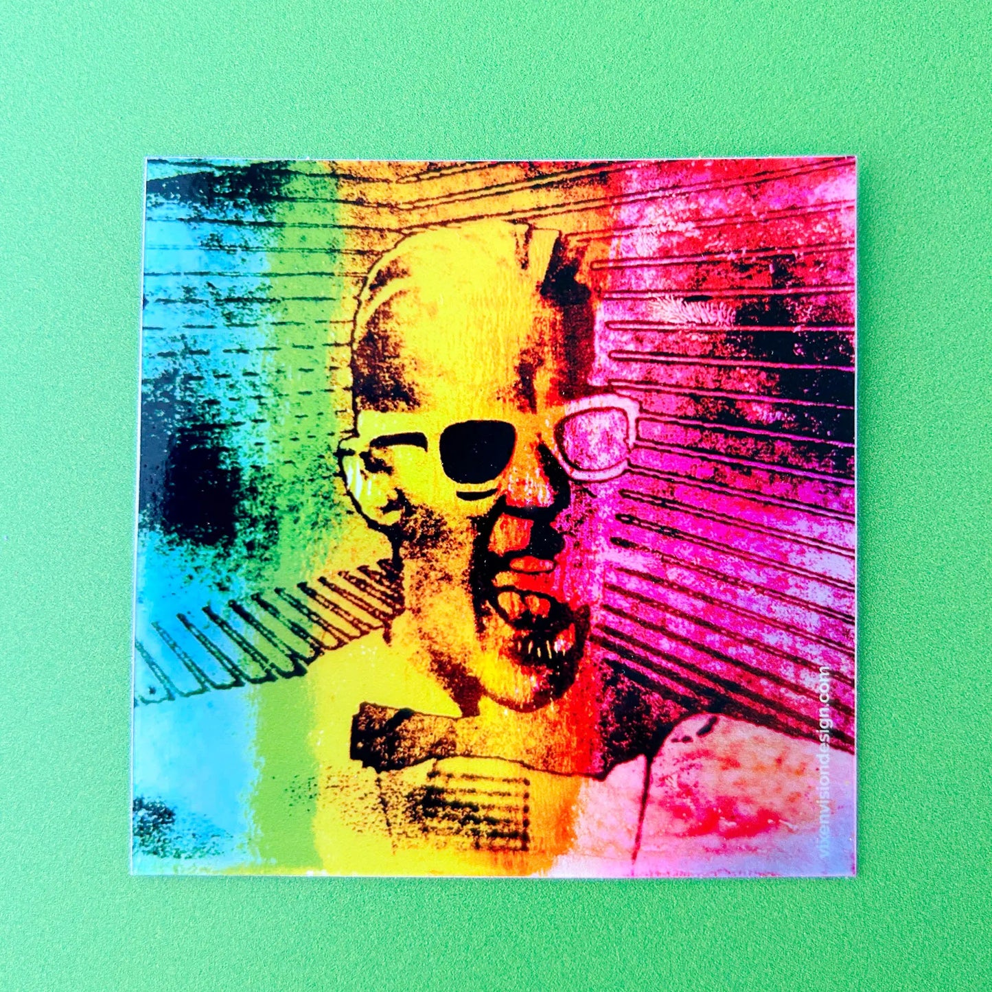 Max's Electric Personality Holographic 3" Vinyl Sticker on a green backround