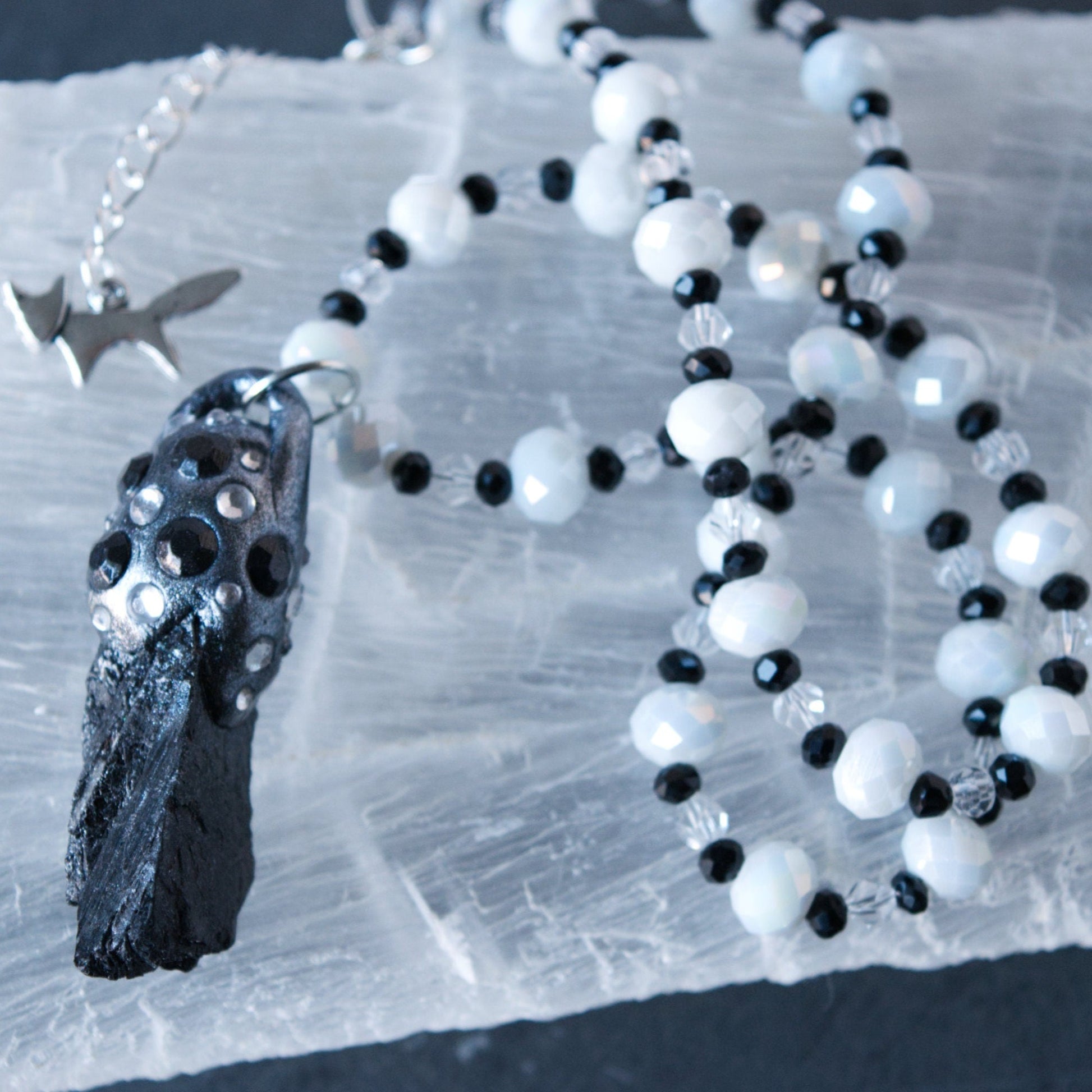 Raw Tektite and Clay Pendant Bead Necklace on Selenite
