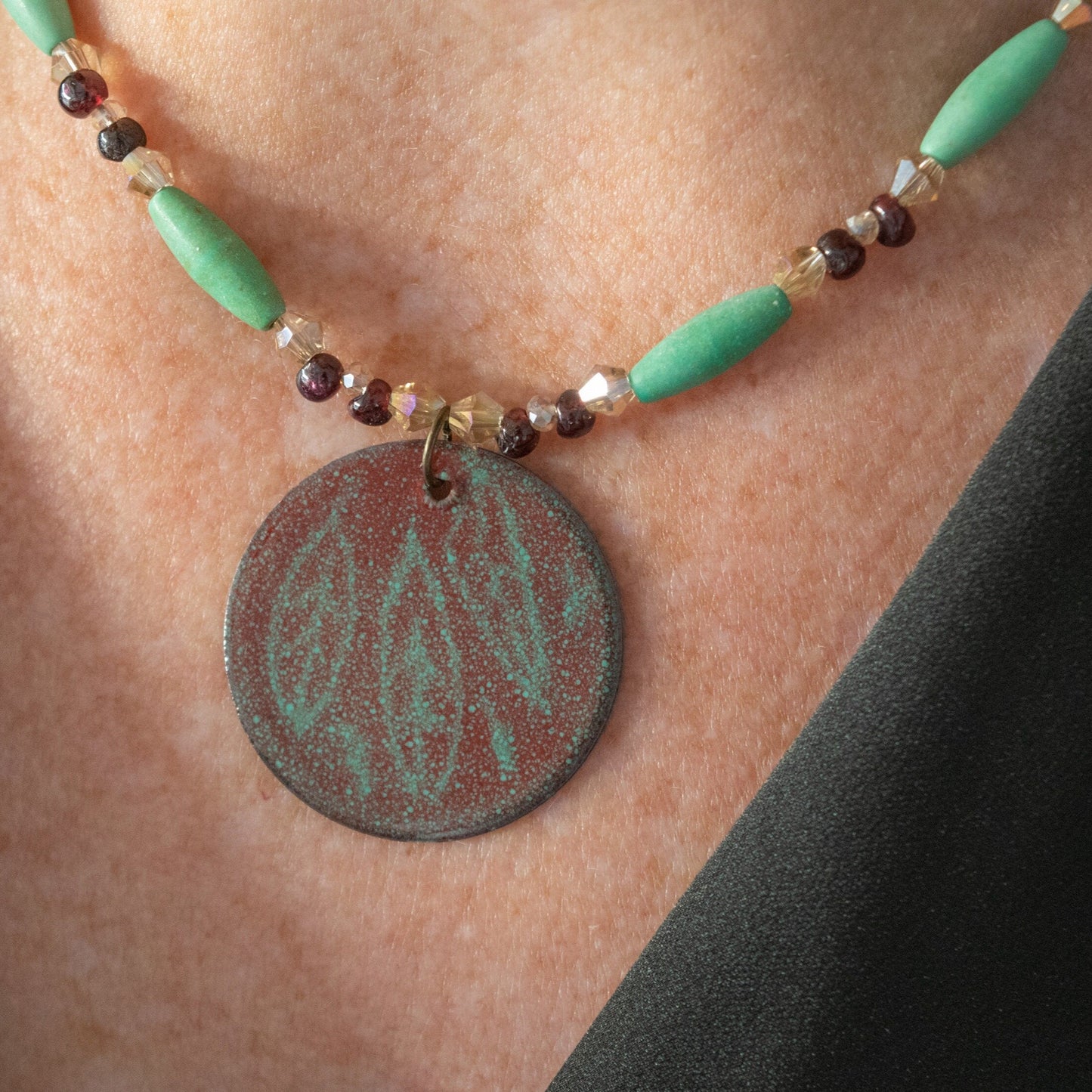 Red and Green Etched Leaf Enamel Pendant with Garnet and Magnesite Bead Necklace on model