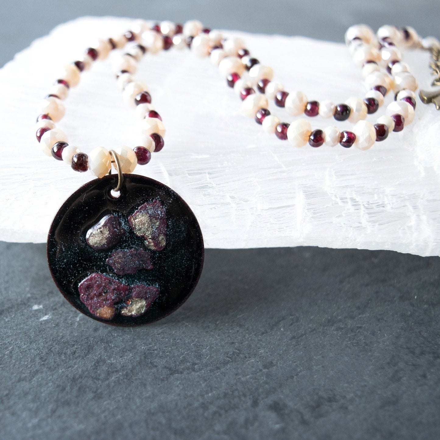 Copper Enamel Pendant and Garnet and Glass Bead Necklace close up