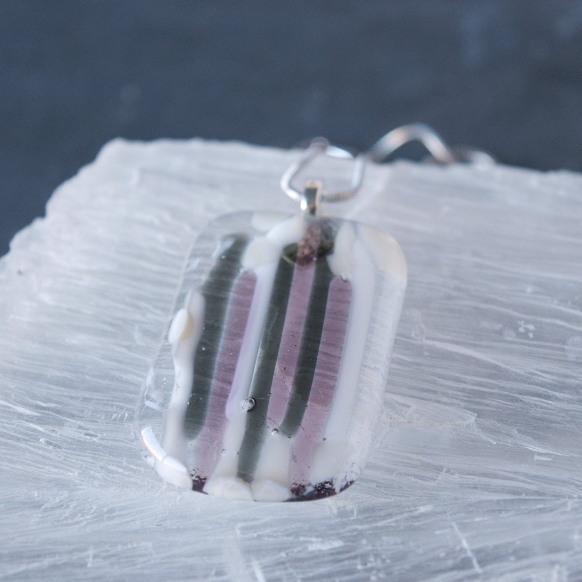 Purple and Gray Fused Glass Pendant Necklace on Selenite Close Up