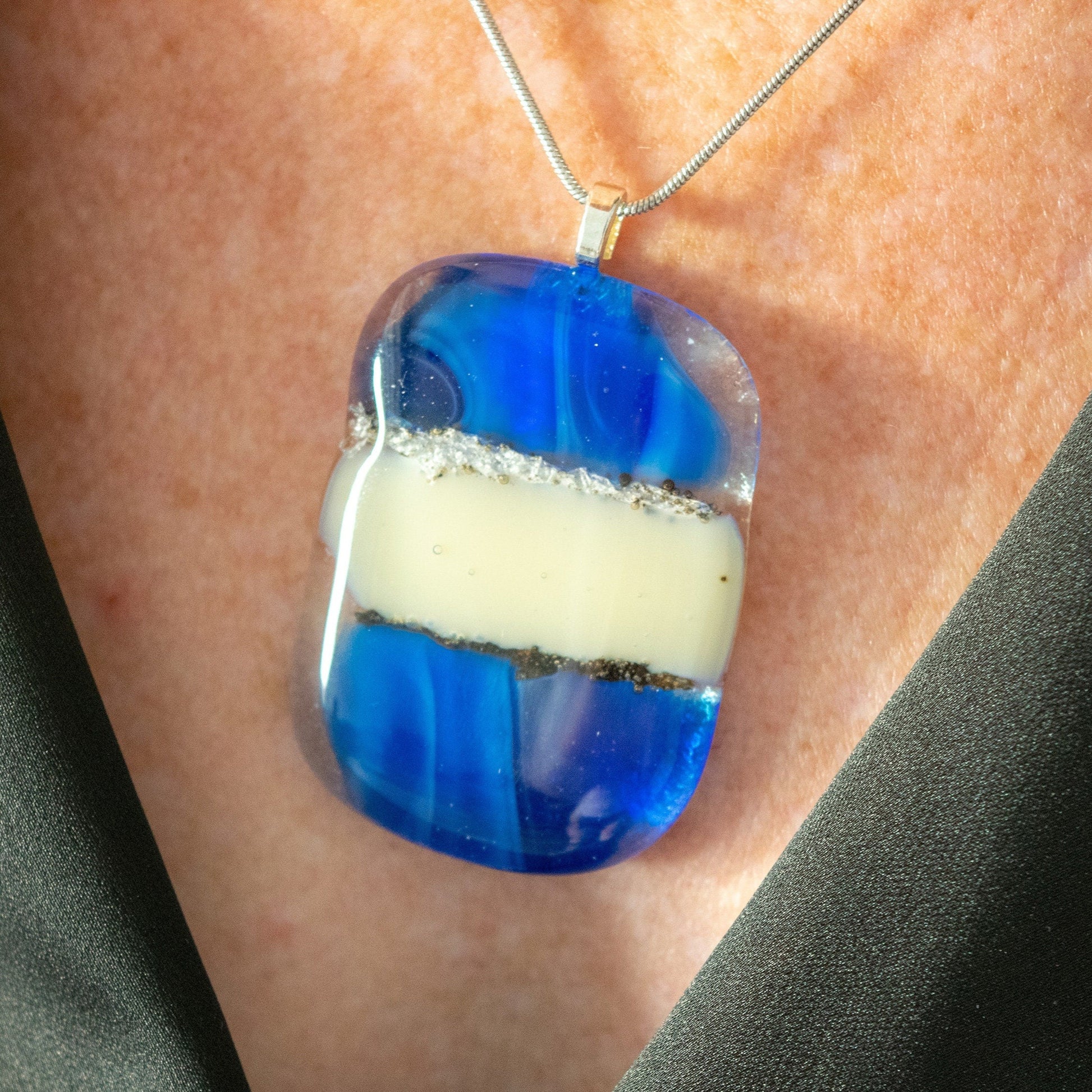 Cobalt Blue and Cream Abstract Fused Glass Pendant Necklace on model