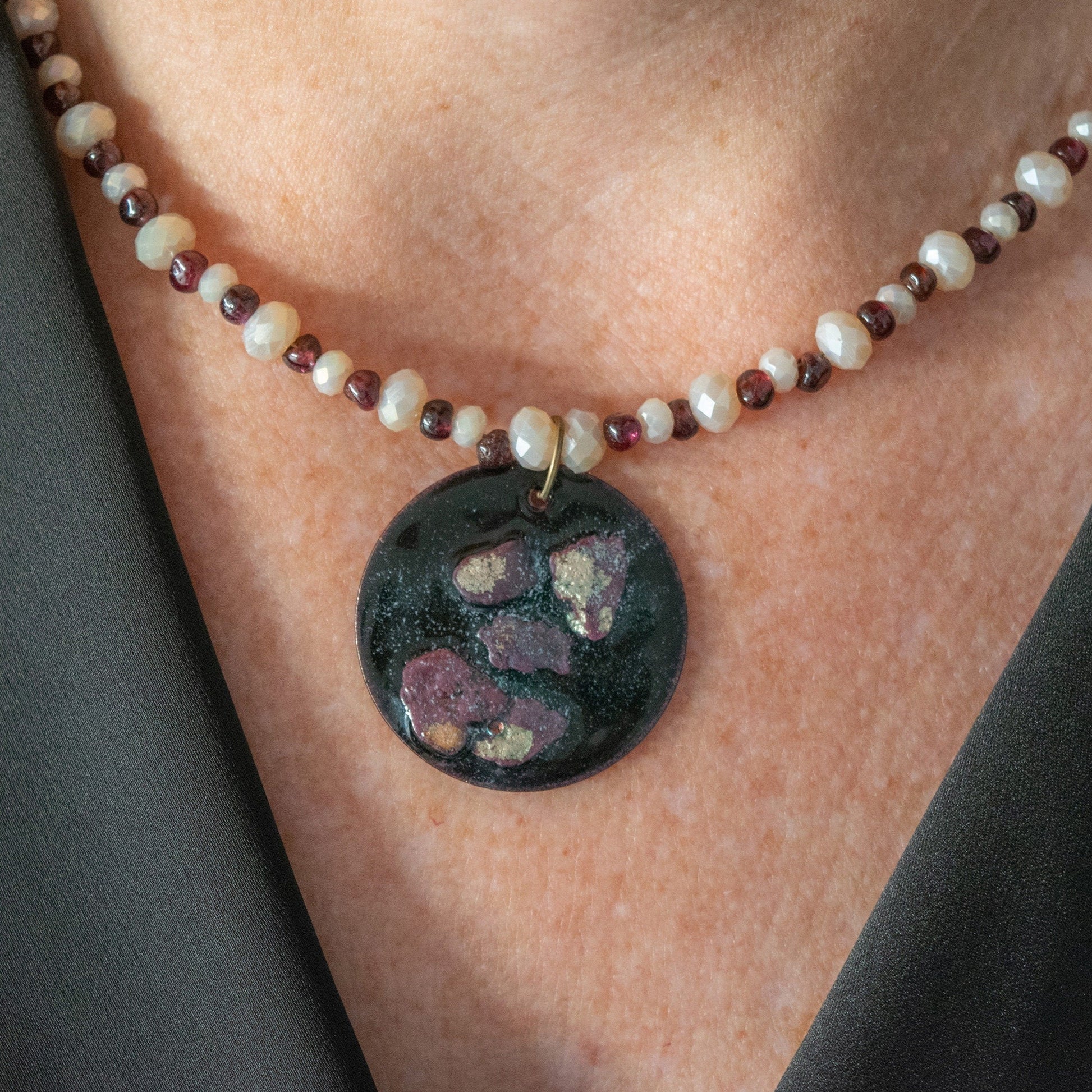 Copper Enamel Pendant and Garnet and Glass Bead Necklace on model