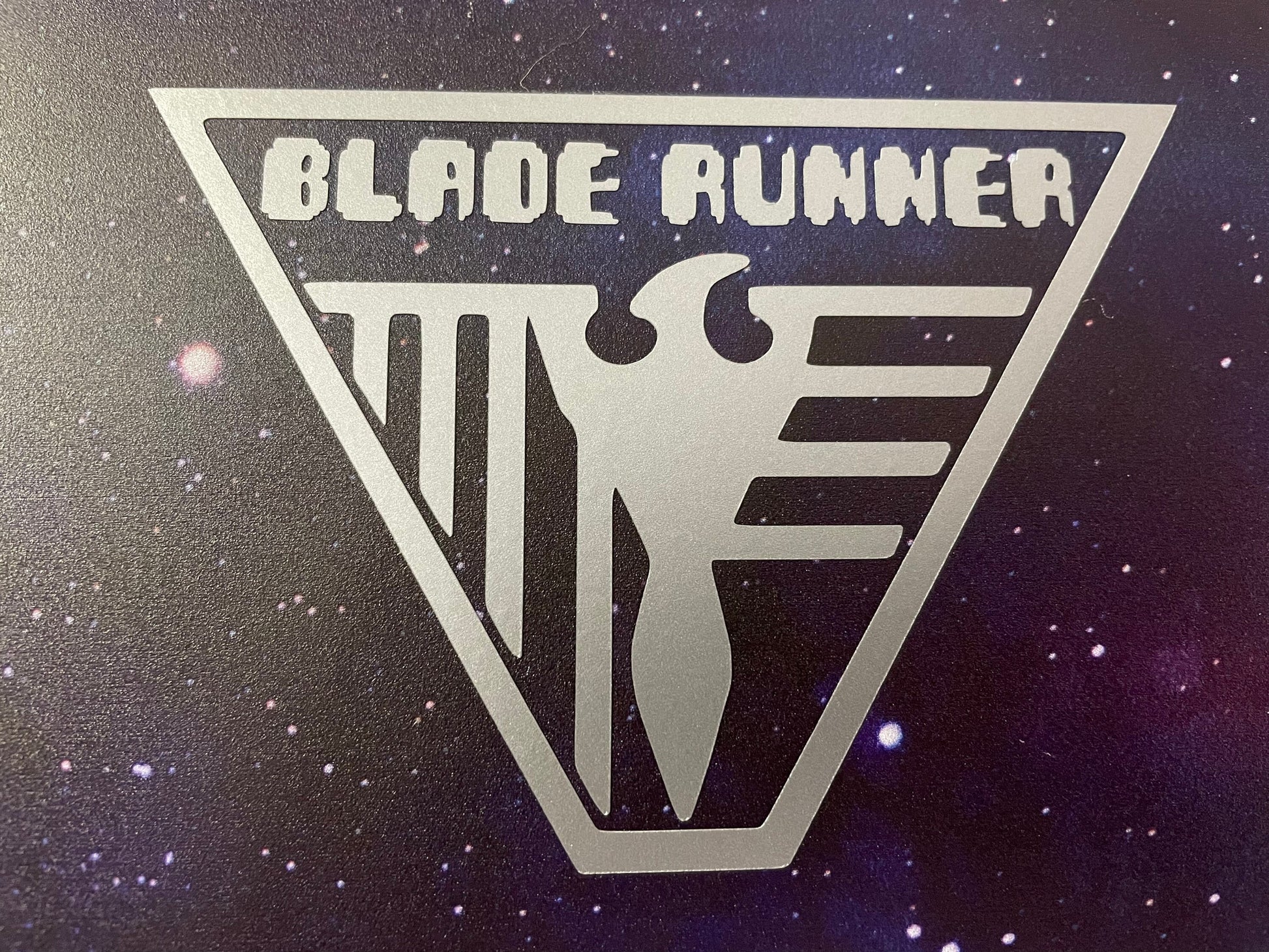 Blade Runner Badge Geek Vinyl Decal in silver on MacBook cover