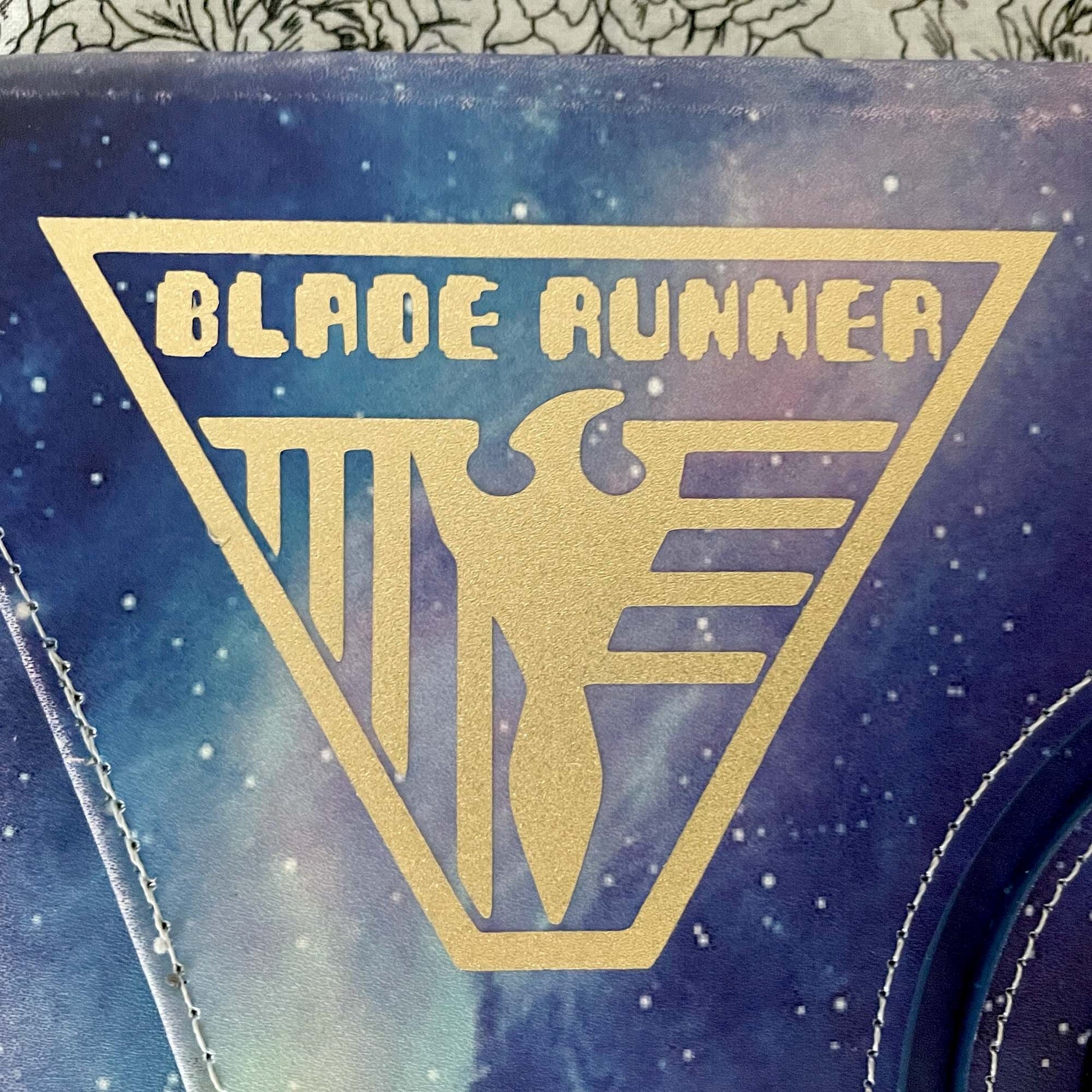 Blade Runner Badge Geek Vinyl Decal in shimmer gold on iPad cover