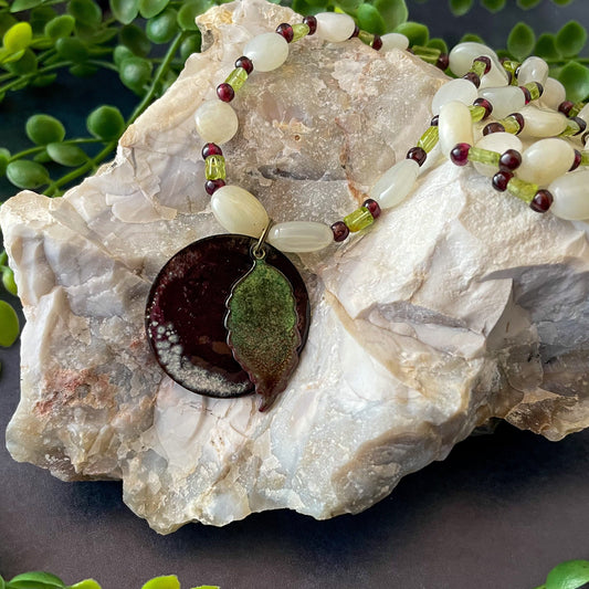 Green Leaf and Burgundy Circle Layered Enamel Pendant Moonstone, Garnet, and Peridot Bead Necklace